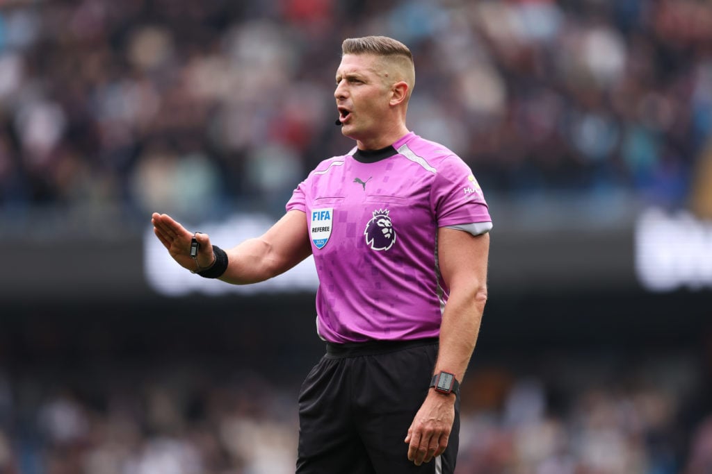 Rob Jones refereeing in the Premier League.