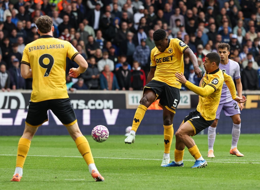 Marshall Munetsi volleys the ball for Wolves.