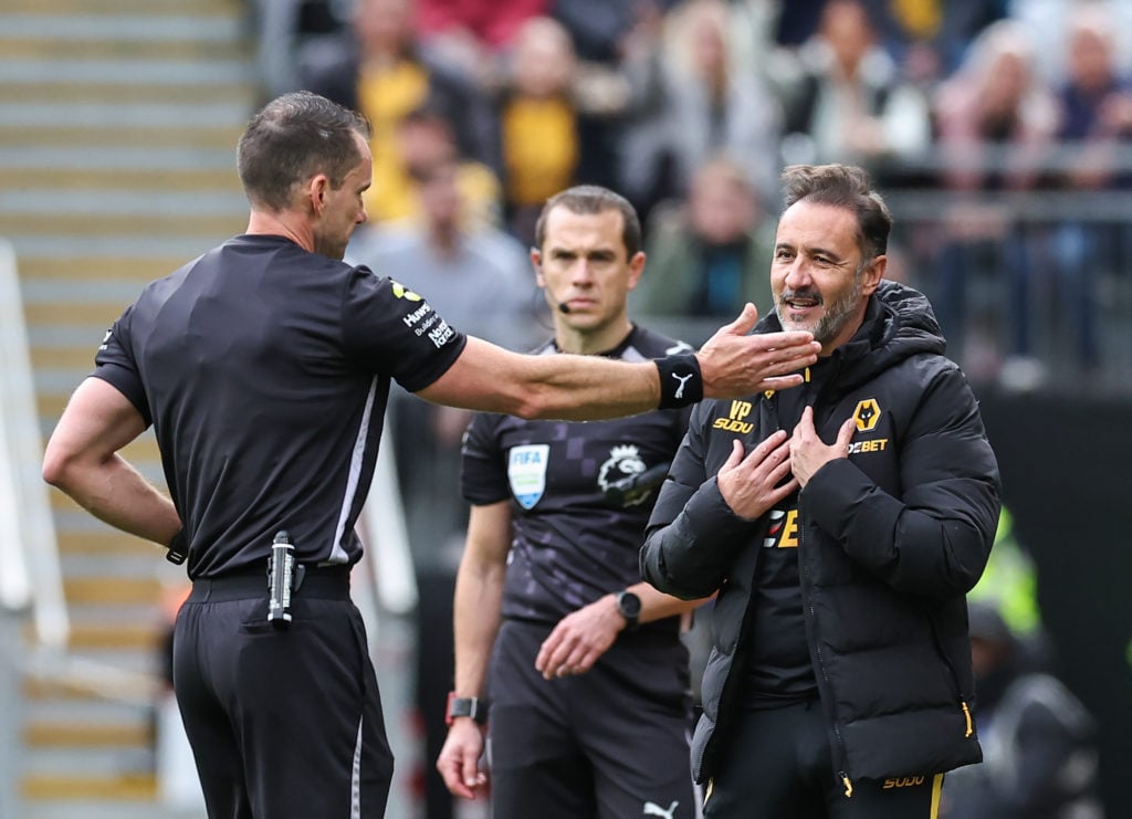 Referee Jarred Gillett tells Wolverhampton Wanderers manager Vitor Pereira to leave the pitch after showing him a red card