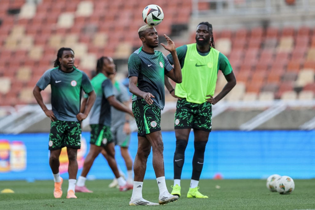 Nigeria's forward #9 Victor Osimhen (C) and Tolu Arokodare warm up ahead of the FIFA World Cup 2026 Africa qualifiers