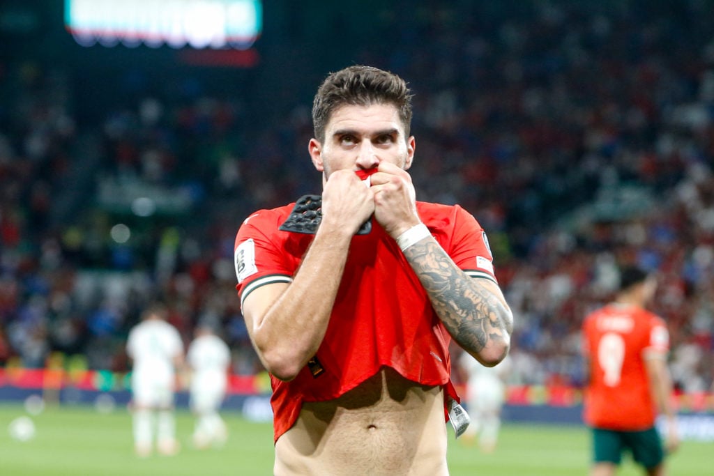 Ruben Neves kisses the Portugal badge after scoring.