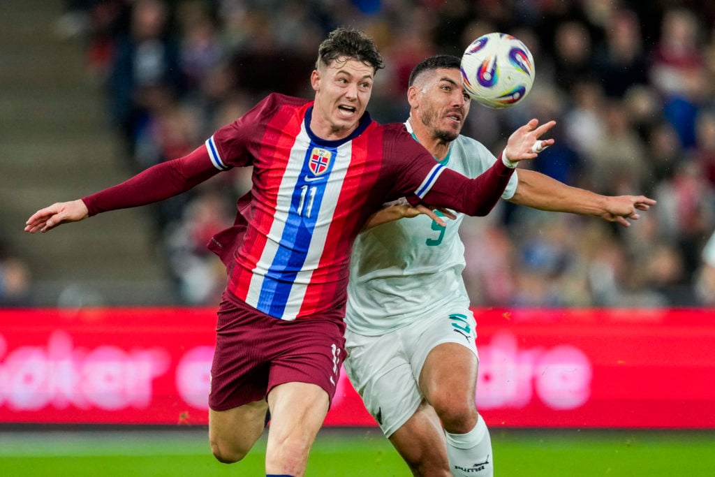 Jorgen Strand Larsen vies for possession of the ball for Norway.
