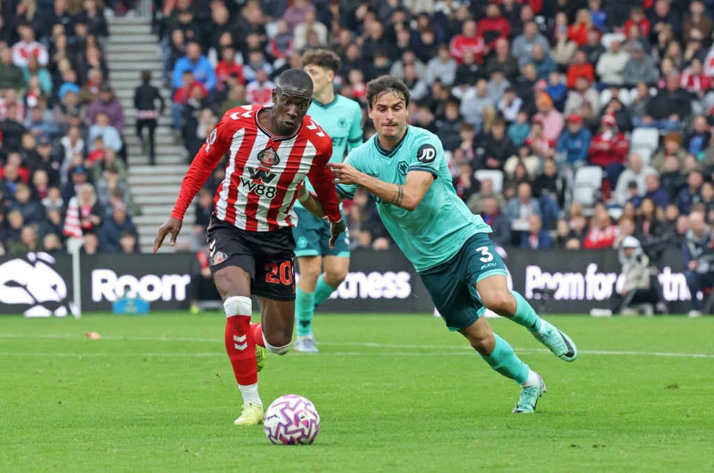 Nordi Mukiele of Sunderland (L) takes on Hugo Bueno of Wolves