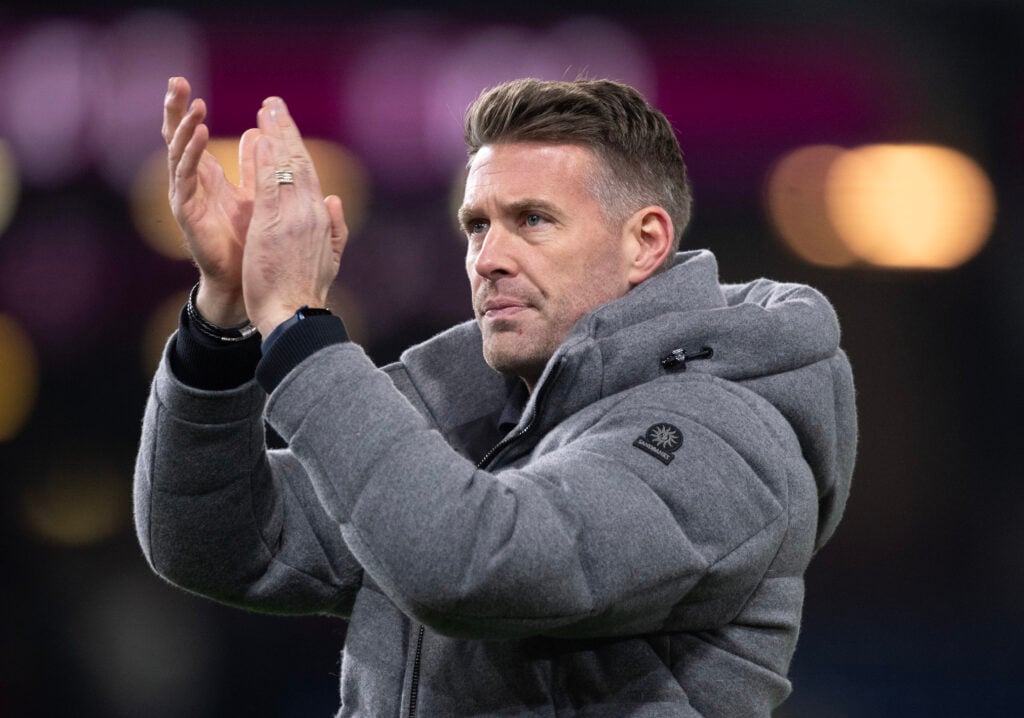 Middlesbrough head coach Rob Edwards claps fans.