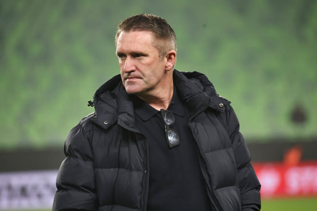 Robbie Keane looks on.