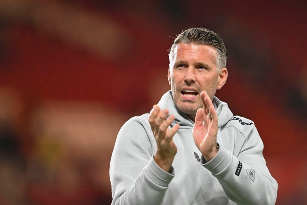 Rob Edwards applauds fans.