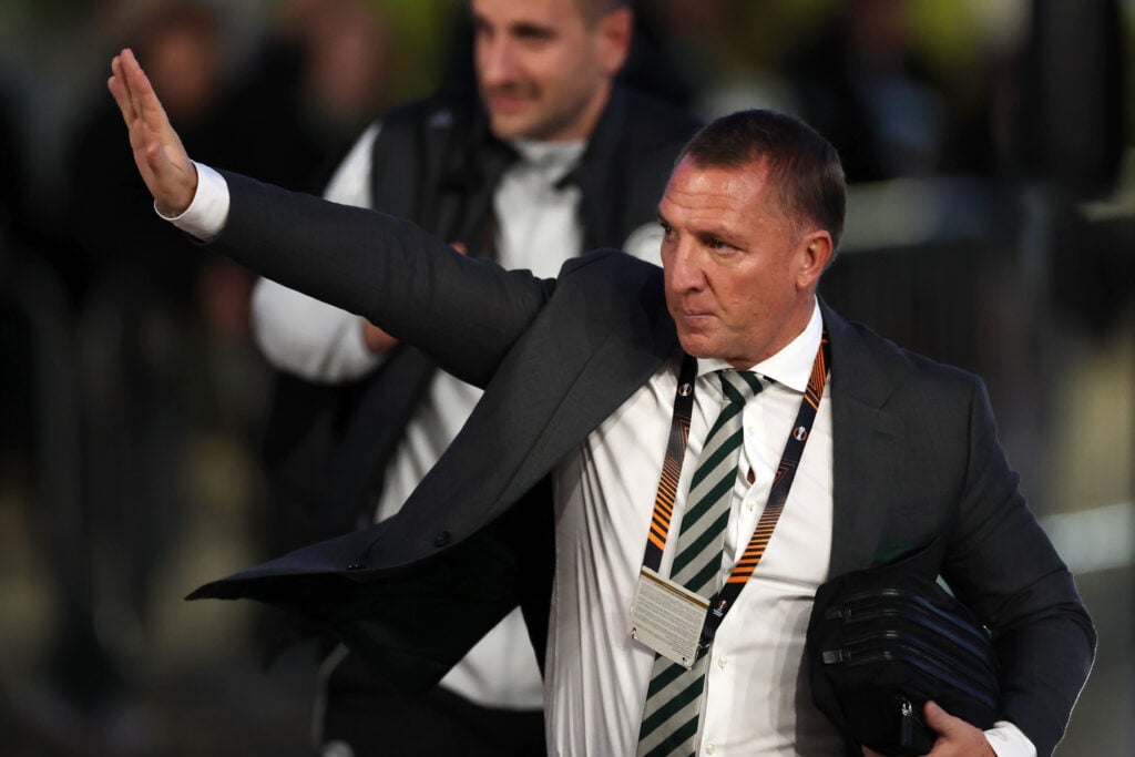 Brendan Rodgers waves.