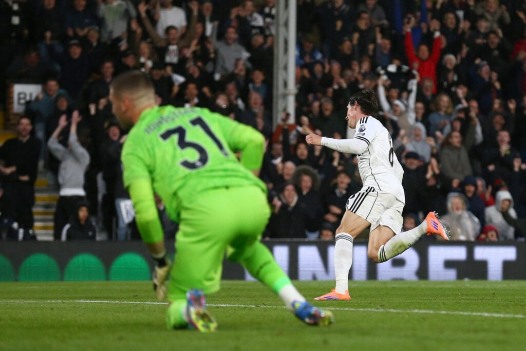 Harry Wilson celebrates scoring with Sam Johnstone in the background