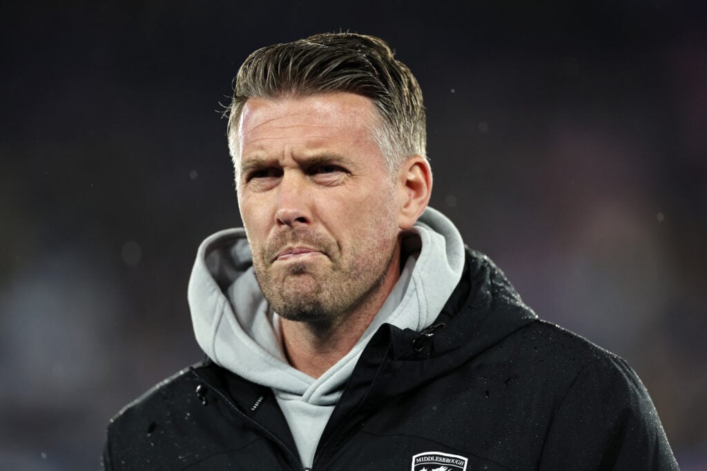 Rob Edwards looks on.