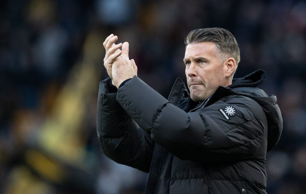 Rob Edwards applauds Wolves fans after playing Crystal Palace