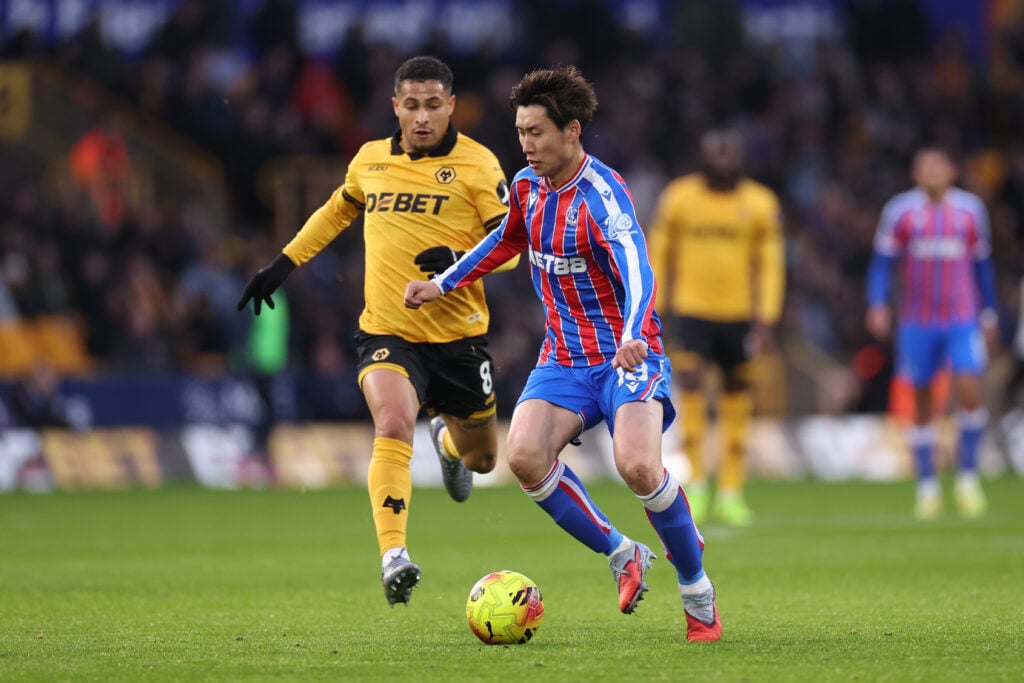 Joao Gomes battling for the ball against Daichi Kamada