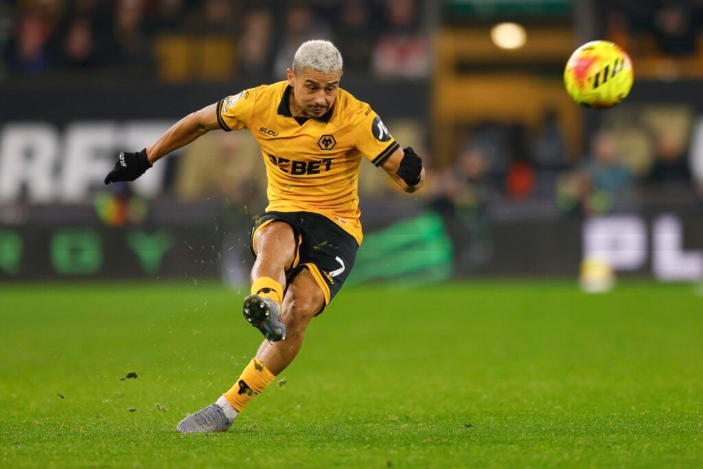 Andre plays a ball for Wolves.