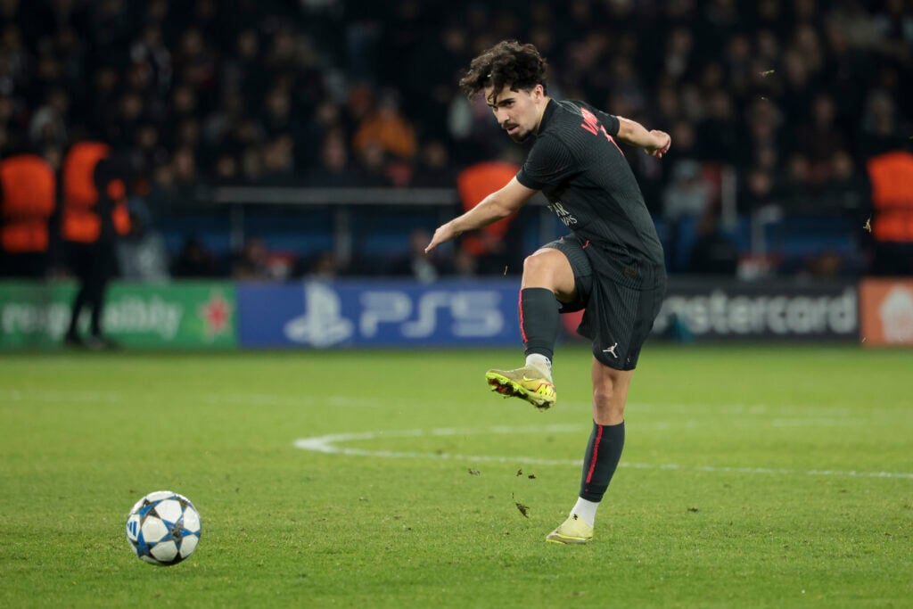 Vitinha striking the ball for PSG in the Champions League