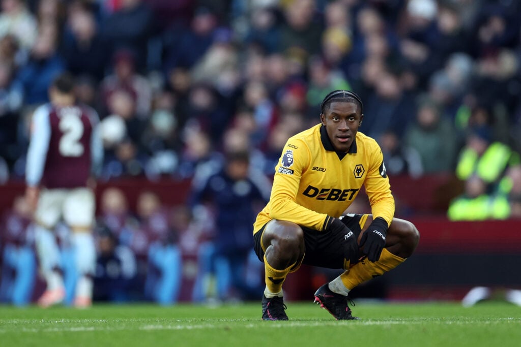 Jean-Ricner Bellegarde crouches while playing for Wolves.