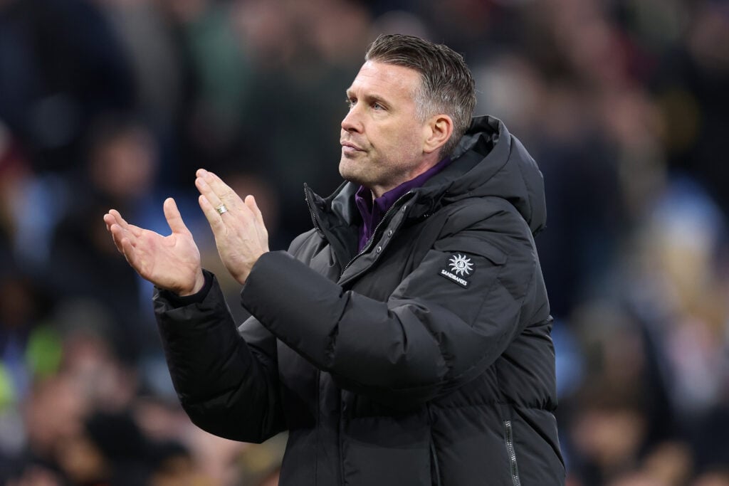 Rob Edwards applauds Wolves fans after the final whistle