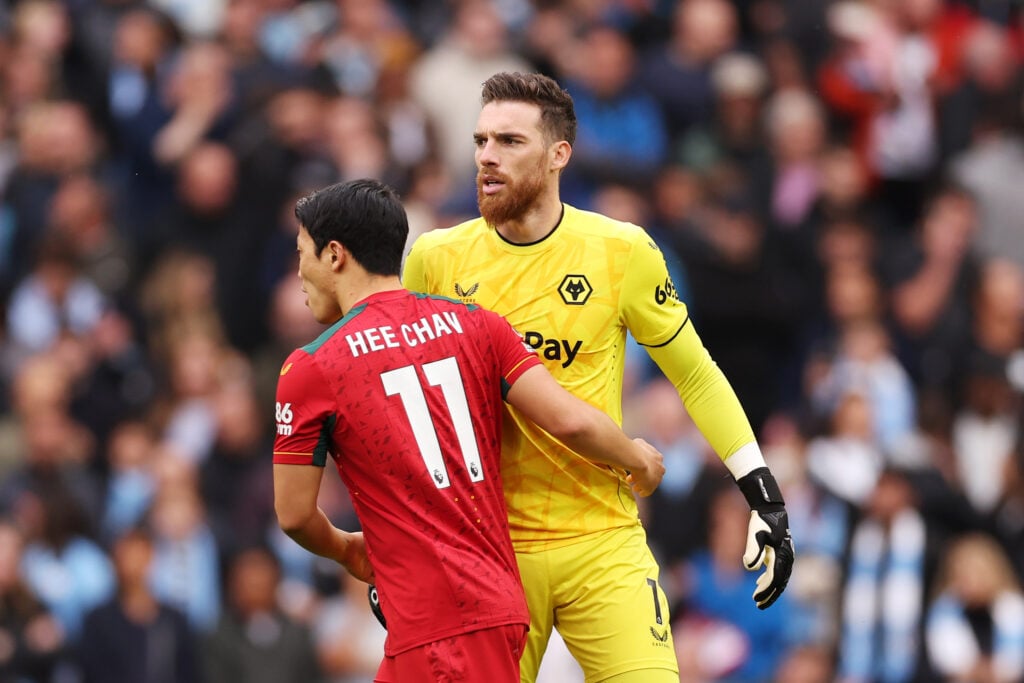 Hwang Hee-Chan and wof Wolverhampton Wanderers interact during the Premier League match between Manchester City and Wolverhampton Wanderers at Etihad Stadium