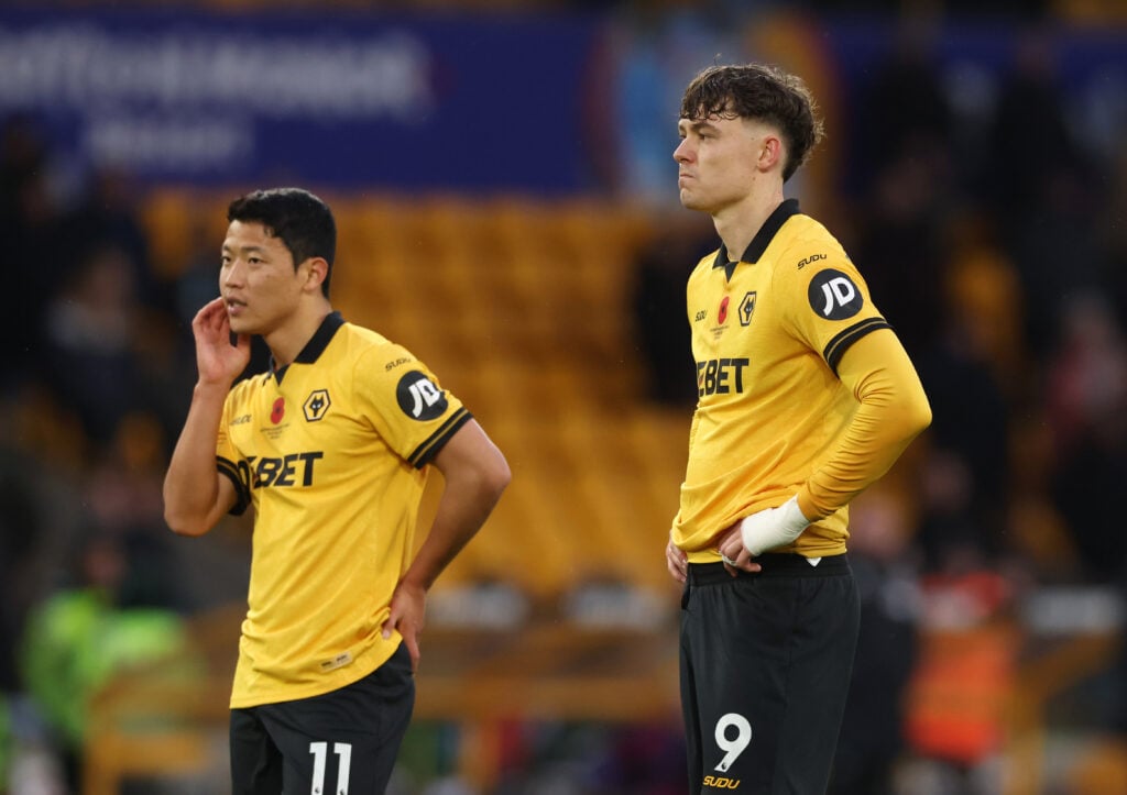 Hwang Hee-chan and Jorgen Strand Larsen look on at Molineux.