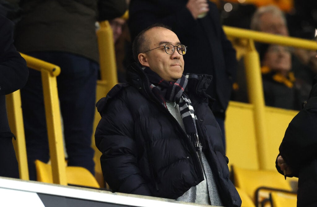 Wolves chairman Jeff Shi looks on at Molineux.