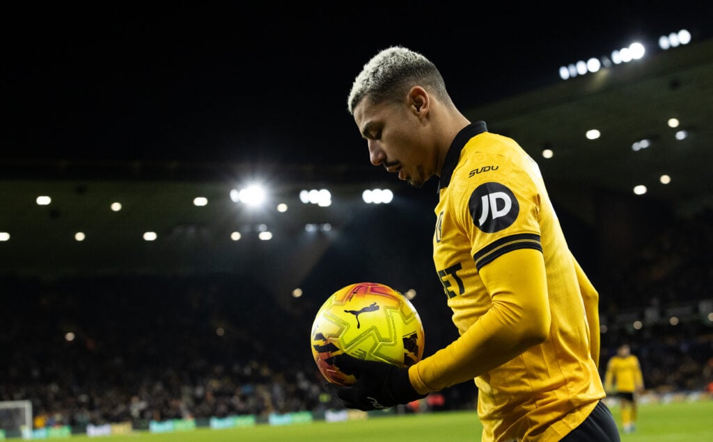 Andre carries the ball for Wolves.