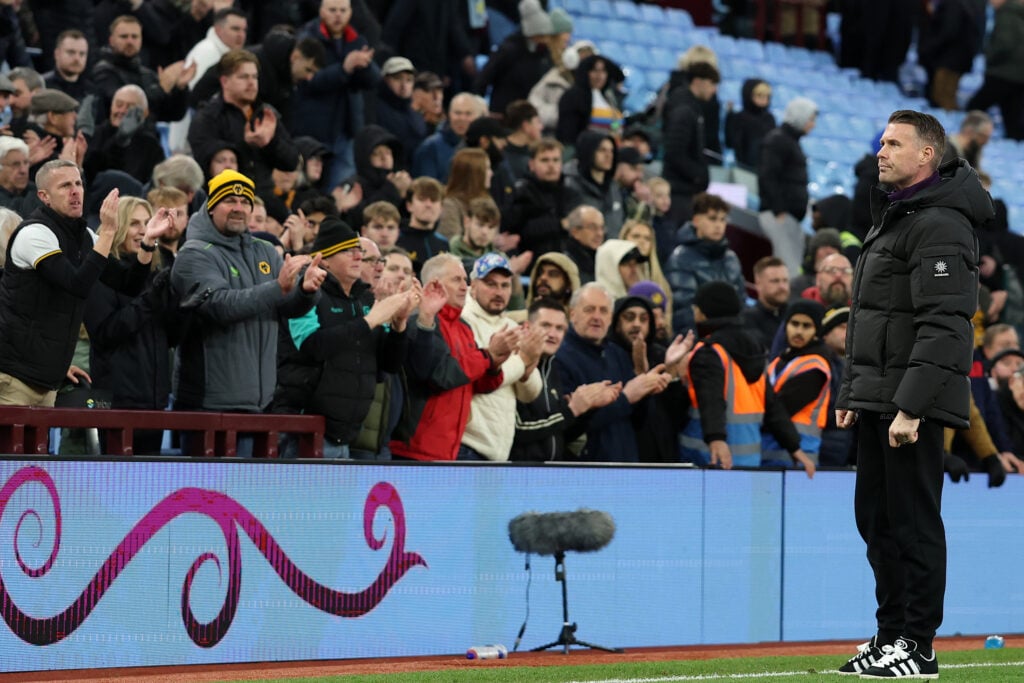 Rob Edwards stands in front of Wolves fans