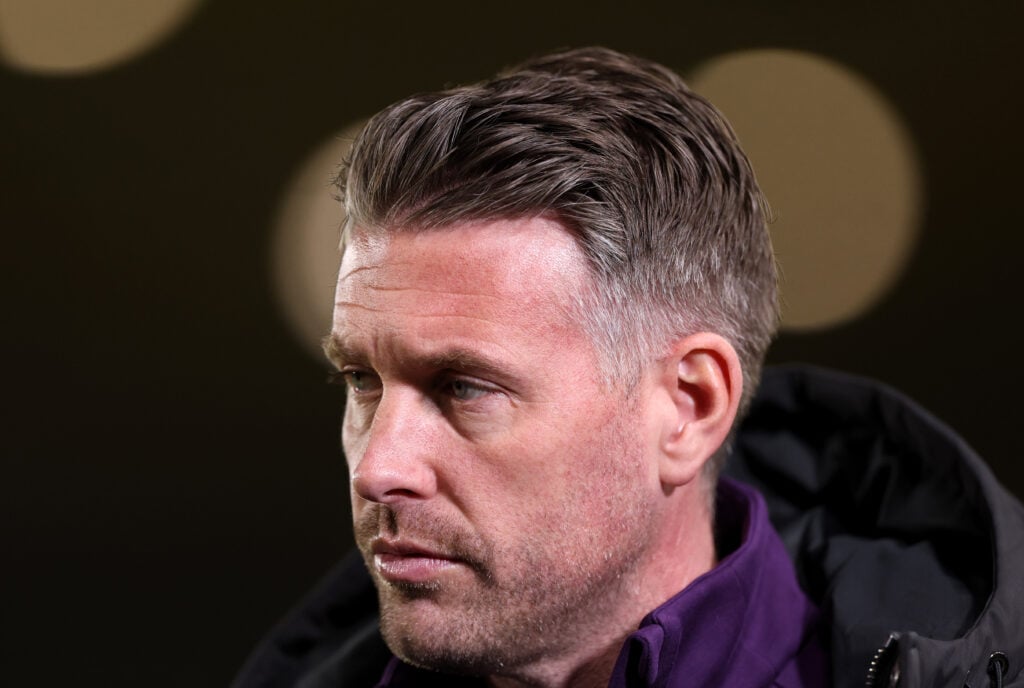 Wolves head coach Rob Edwards looks on