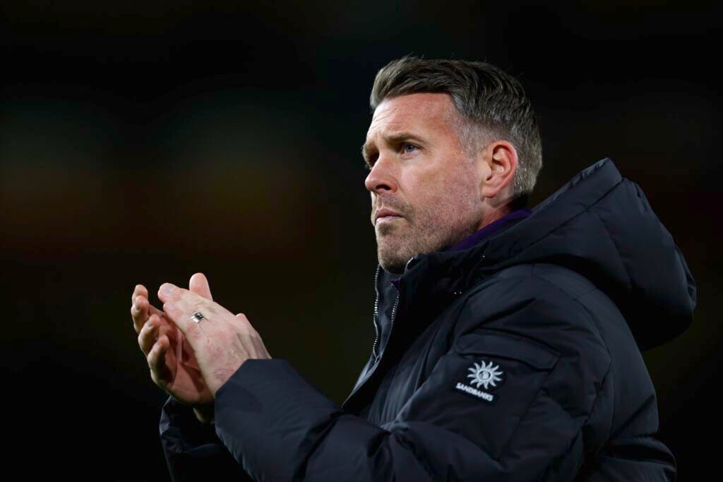 Rob Edwards claps fans at Molineux.