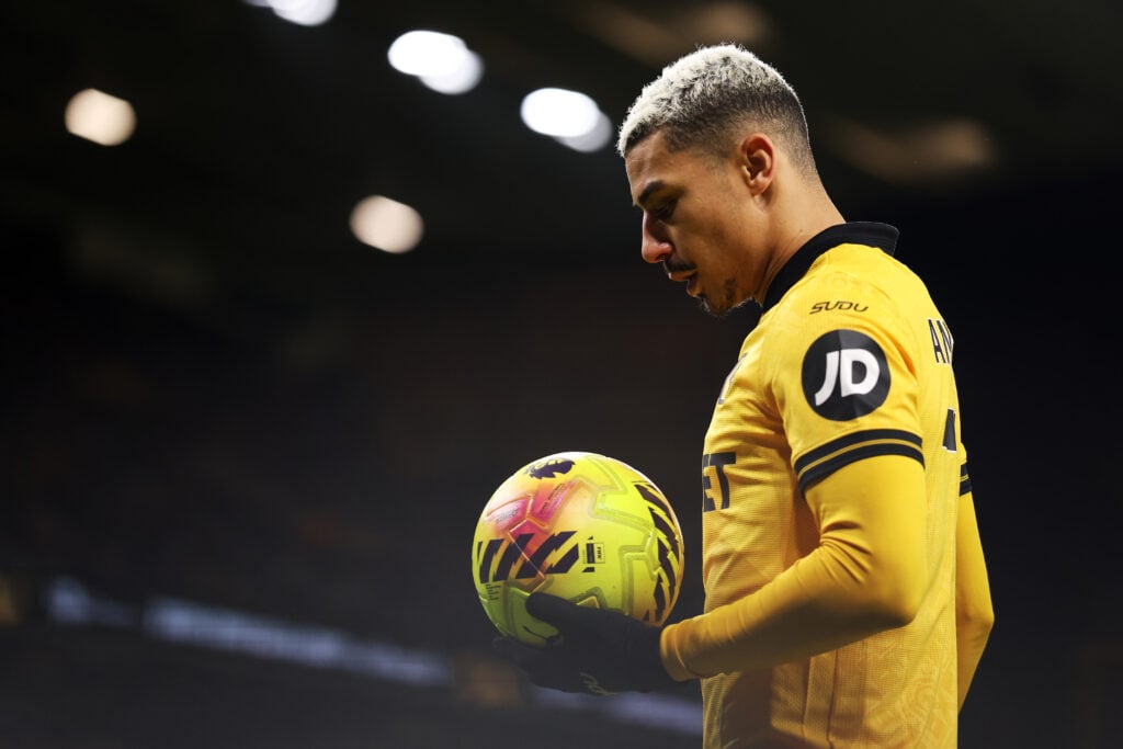 Andre holding the ball while playing for Wolves