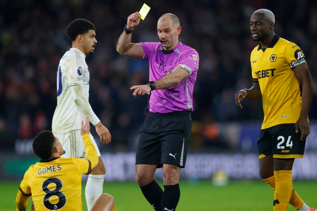 Joao Gomes is shown a yellow card against Nottingham Forest.
