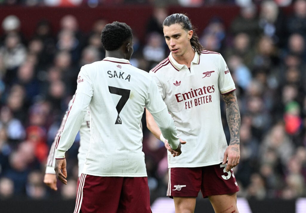 Bukayo Saka and Riccardo Calafiori of Arsenal interact during the Premier League match between Aston Villa and Arsenal