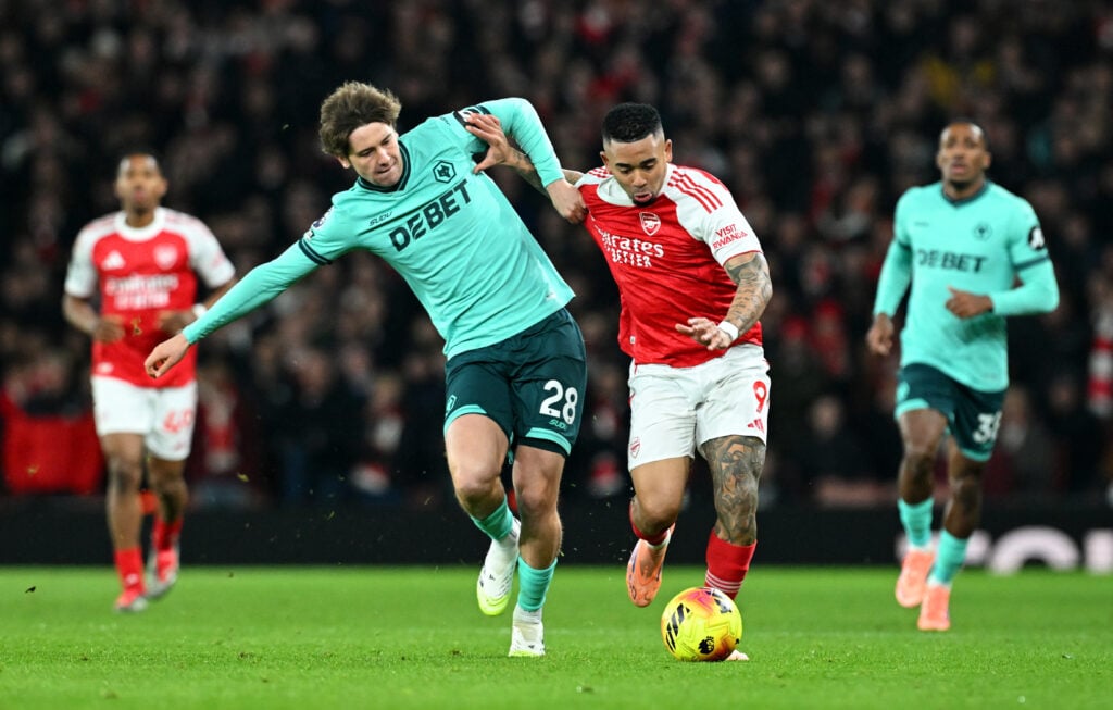 Gabriel Jesus of Arsenal is challenged by Fer Lopez of Wolverhampton Wanderers during the Premier League match between Arsenal and Wolverhampton Wanderers