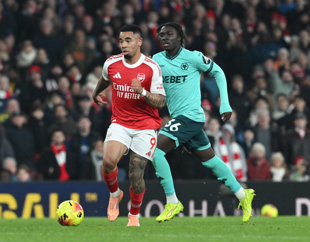 Gabriel Jesus of Arsenal breaks past Mateus Mane of Wolves during the Premier League match between Arsenal and Wolverhampton Wanderers