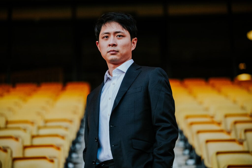 Nathan Shi looks on at Molineux.