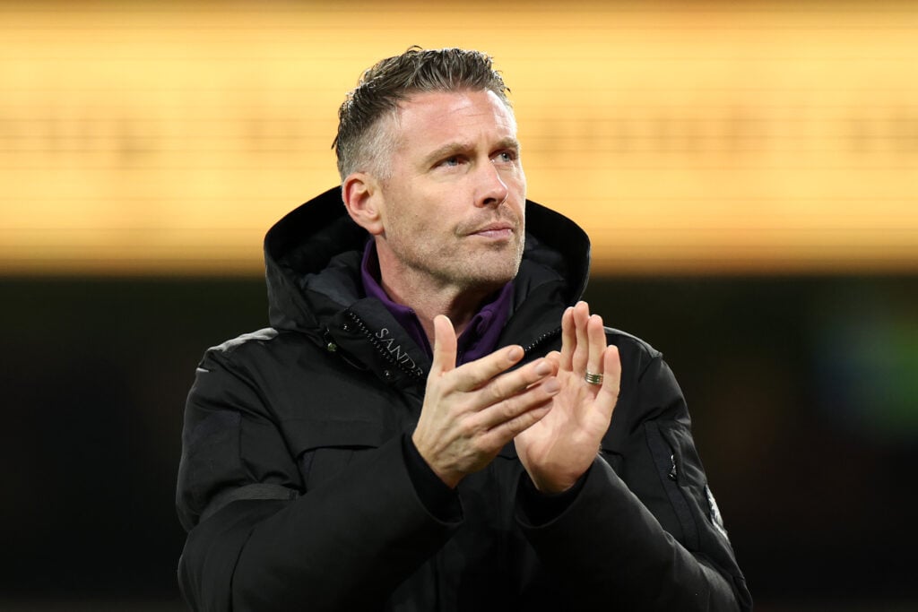 Rob Edwards applauds fans at Molineux