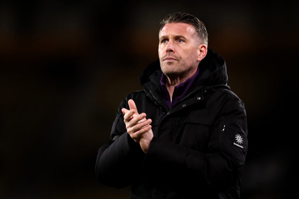 Rob Edwards, Manager of Wolverhampton Wanderers, applauds fans during the Premier League match between Wolverhampton Wanderers and Brentford