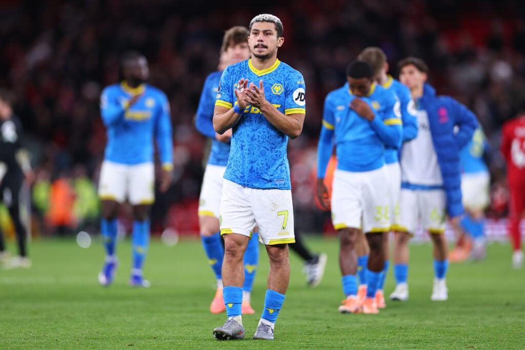 Andre applauds Wolves fans at Anfield