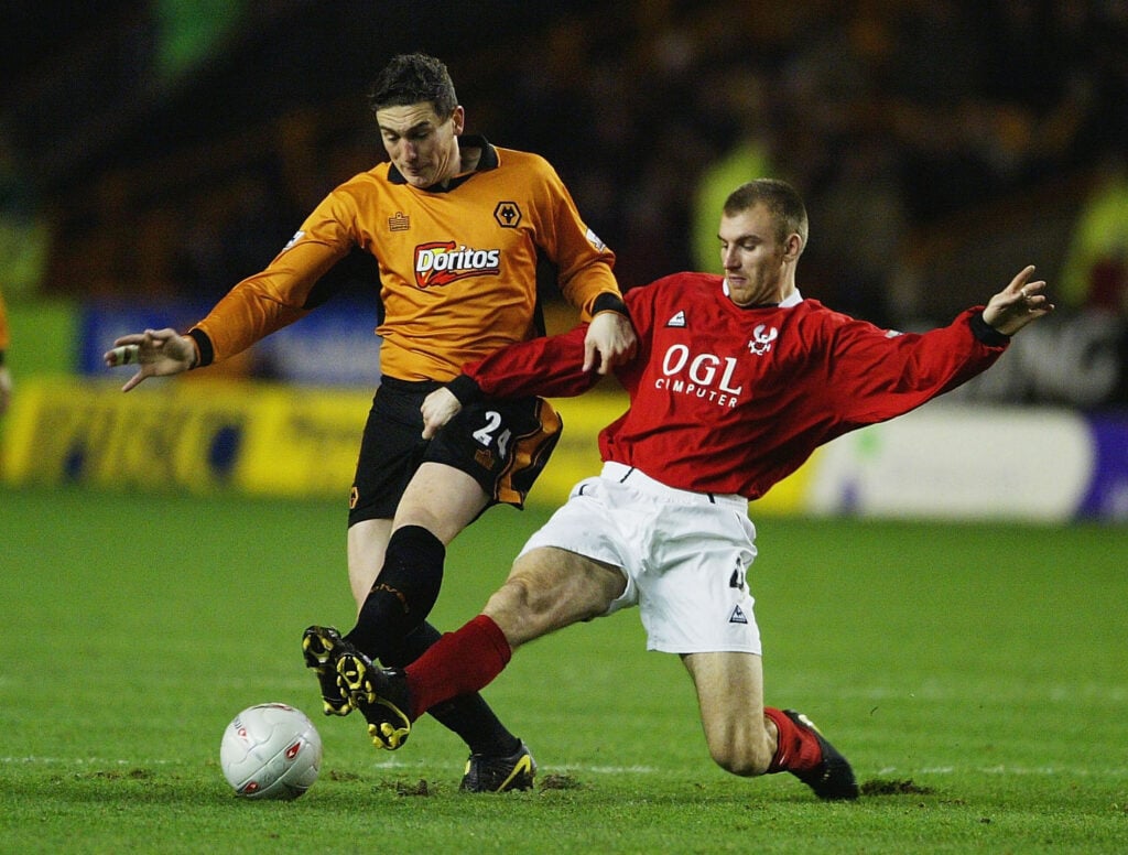 Danny Williams of Kidderminster Harriers tackles Keith Andrews of Wolverhampton Wanderers during the FA Cup third round replay match between Wolverhampton Wanderers and Kidderminster Harriers at Molineux on January 13, 2004