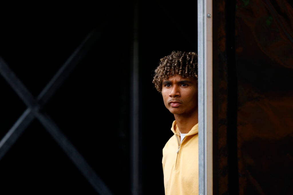 Pedro Lima looks on.