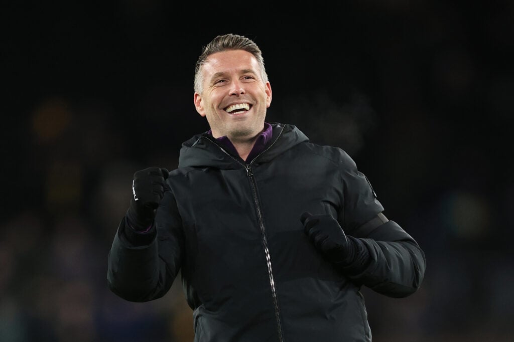 Rob Edwards cheers after a Wolves win.