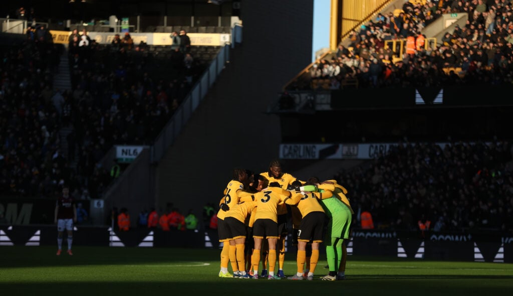 Wolves players in a huddle at Molineux.