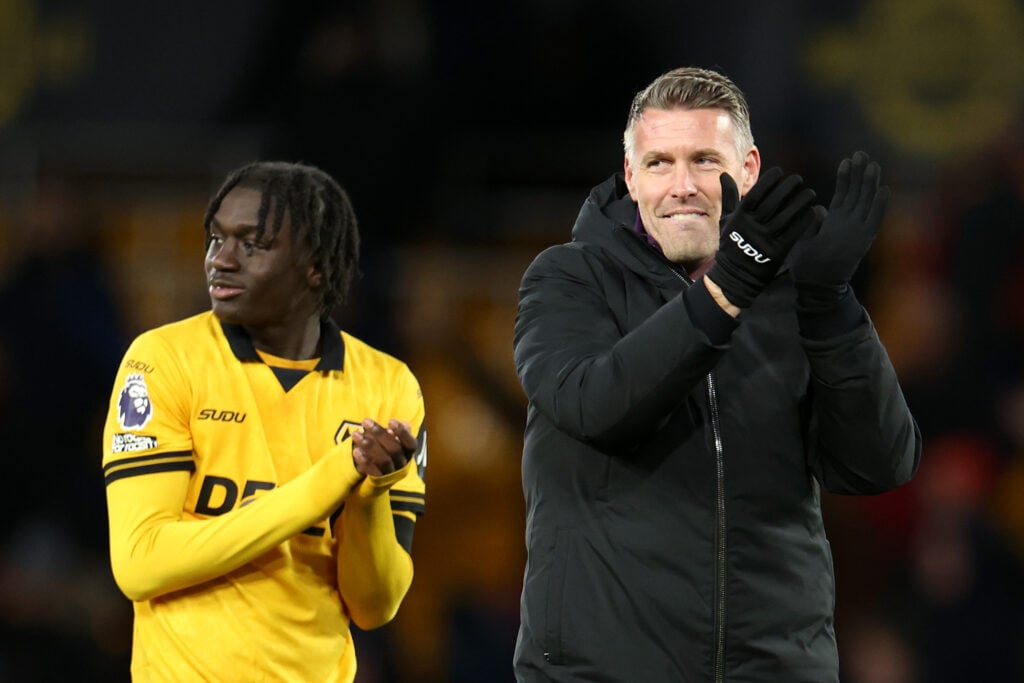 Mateus Mane and Rob Edwards clap the fans at Molineux.