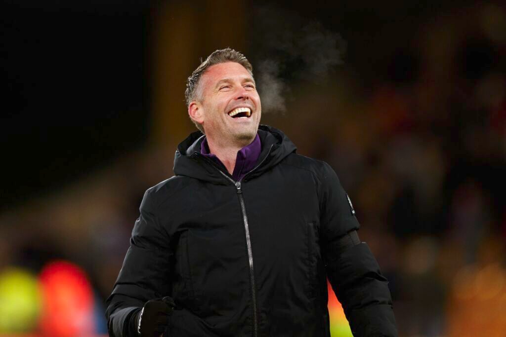 Wolves manager Rob Edwards laughing.