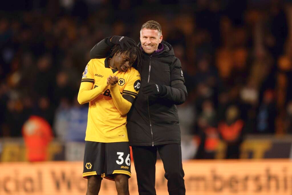 Rob Edwards embraces Mateus Mane.