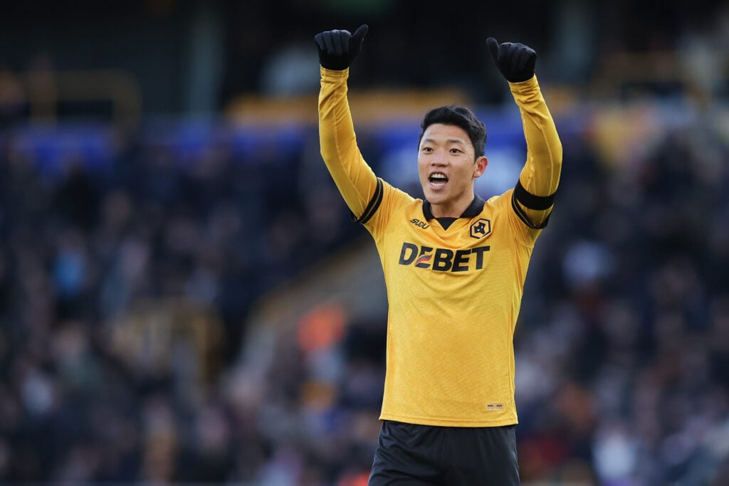 Hwang Hee-chan makes a signal while playing for Wolves.