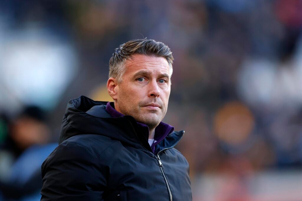 Wolves manager Rob Edwards looks on.