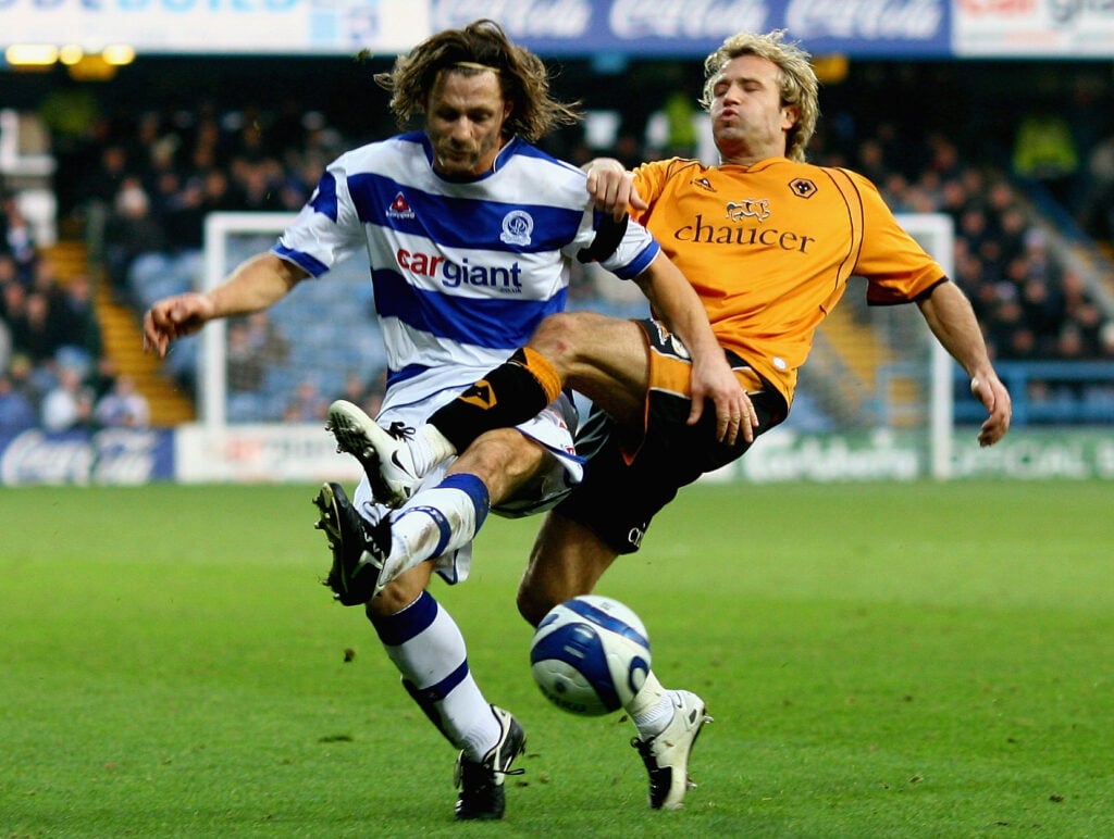 Gareth Ainsworth of Queens Park Rangers tangles with Michael Gray of Wolverhampton Wanderers during the Coca-Cola Championship match between Queens Park Rangers and Wolverhampton Wanderers