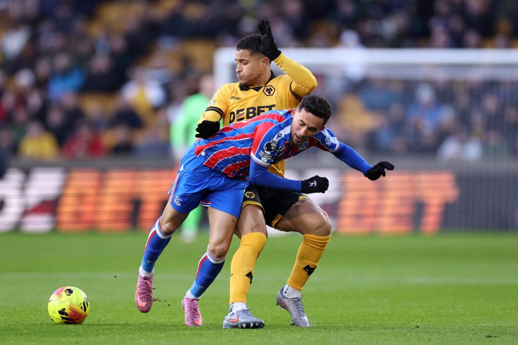 Joao Gomes battles for the ball for Wolves.