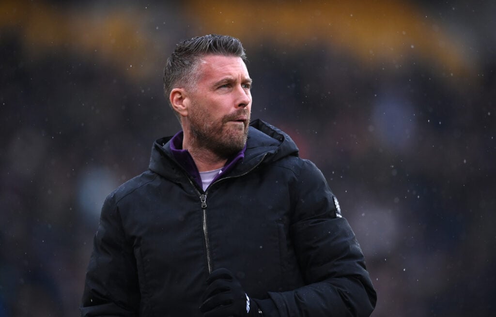 Wolves manager Rob Edwards looks on.