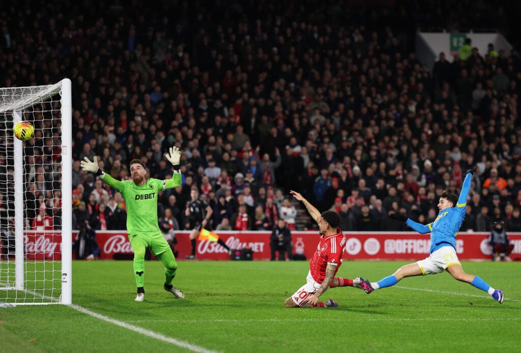 Jose Sa makes a save for Wolves.