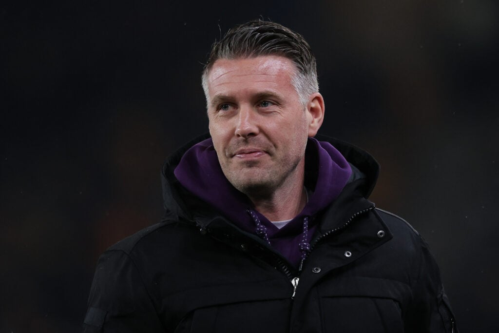 Wolves manager Rob Edwards smiles.