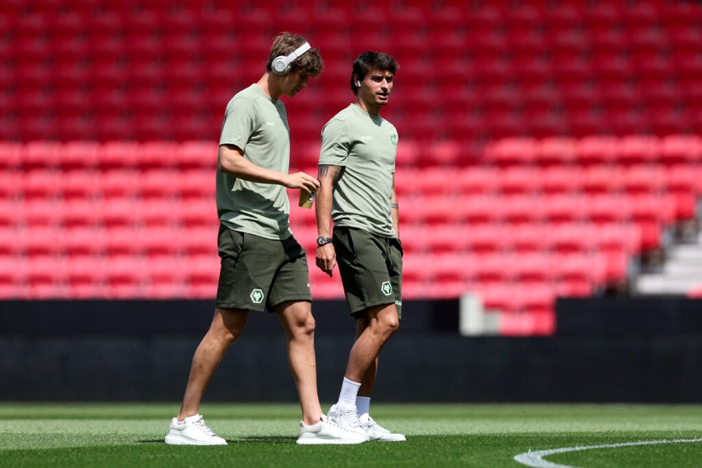 Fer Lopez ad Hugo Bueno walk on the pitch.
